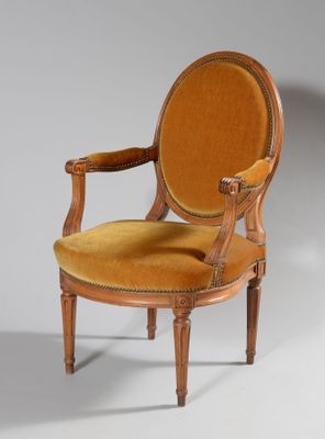 an image of a wooden chair with a yellow upholstered seat