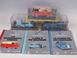 three books on the table with a car and a van in them