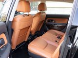 the interior of a car with tan leather seats and black trims
