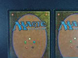 two decks of magic the gathering are on display on a table