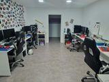 an image of a room with multiple computers and desks