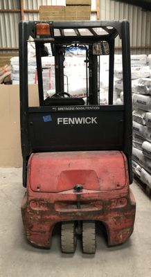 a fork lift truck that is parked in a warehouse