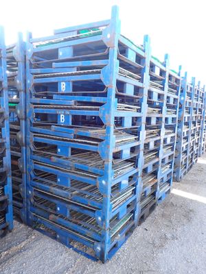 a lot of pallets that are stacked up together