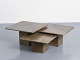 three marble coffee tables stacked on top of each other in a room