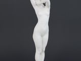 a white statue of a woman holding her head in her hands