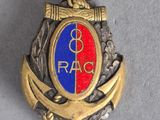 an image of a badge with a red, blue and gold design