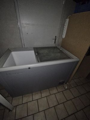a bathtub in the corner of a bathroom with a door open