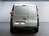 a silver van that is parked in a room