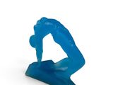a blue sculpture of a man on a surfboard