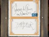 a wooden easel with a white board with writing on it and a wooden easel with a white board with writing on it