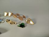 a lot of different types of jewelry on the table