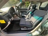 the interior of a car with a steering wheel and seat covers