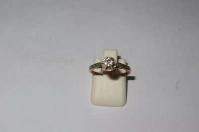 a ring that is sitting on top of a piece of paper