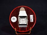 a watch that is sitting on top of a red plate