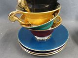 a lot of cups and saucers stacked on top of each other