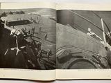 an open book with a picture of a plane on the cover