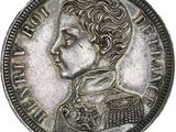 Gros plan sur une pièce de monnaie en argent portant un visage de femme