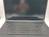 a laptop computer sitting on a desk with a mouse