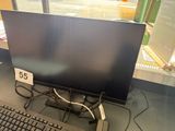 an image of a computer monitor and keyboard in a store