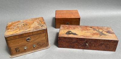 three small wooden boxes with birds painted on them sitting on a table