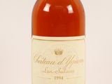 an image of a bottle of wine sitting on top of a table