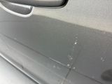 a close up of a car ' s door handle and door handle