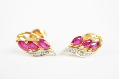 a pair of ruby and diamond earrings