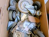 a cardboard box filled with lots of different types of wheels