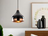 a lamp that is hanging over a bed in a room