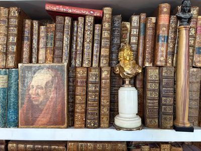 many old books on the shelves in the room