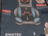 a cardboard box with a picture of a massager on it