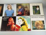 six cd ' s of various albums of various women in various styles