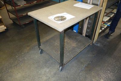 a table that has a fan on it in a room