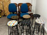six stools that are sitting in the corner of a room