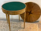 two tables with a green top and a star on the top