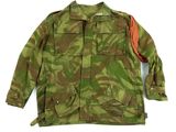 an image of a military jacket with a red patch on the chest