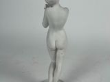 a statue of a woman that is standing on a pedestal