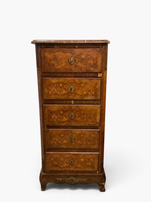 an old wooden chest of drawers with drawers on top of it