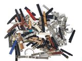many different types of scissors and combs on a white surface