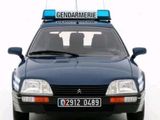 a police car that is parked in front of a white background