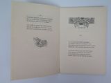 an open book with a drawing of a bird on it