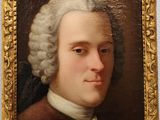 portrait d'un homme vêtu d'un manteau marron et aux cheveux blancs