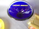 a glass bowl with a blue lid sitting on a table next to a can of soda