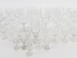 a lot of empty glasses on a white surface