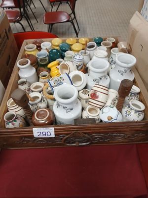 a box full of tea cups and saucers sitting on a table