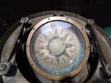 a close up of a clock on the side of a machine