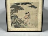 an old picture of a woman standing in front of a tree