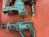 two electric tools that are sitting on a table