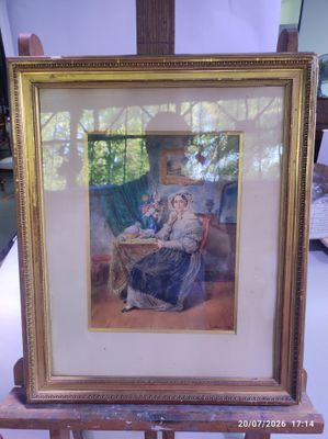 a picture of a woman sitting at a table with a cat