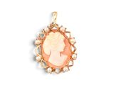 a close up of a pendant with a woman ' s profile on it